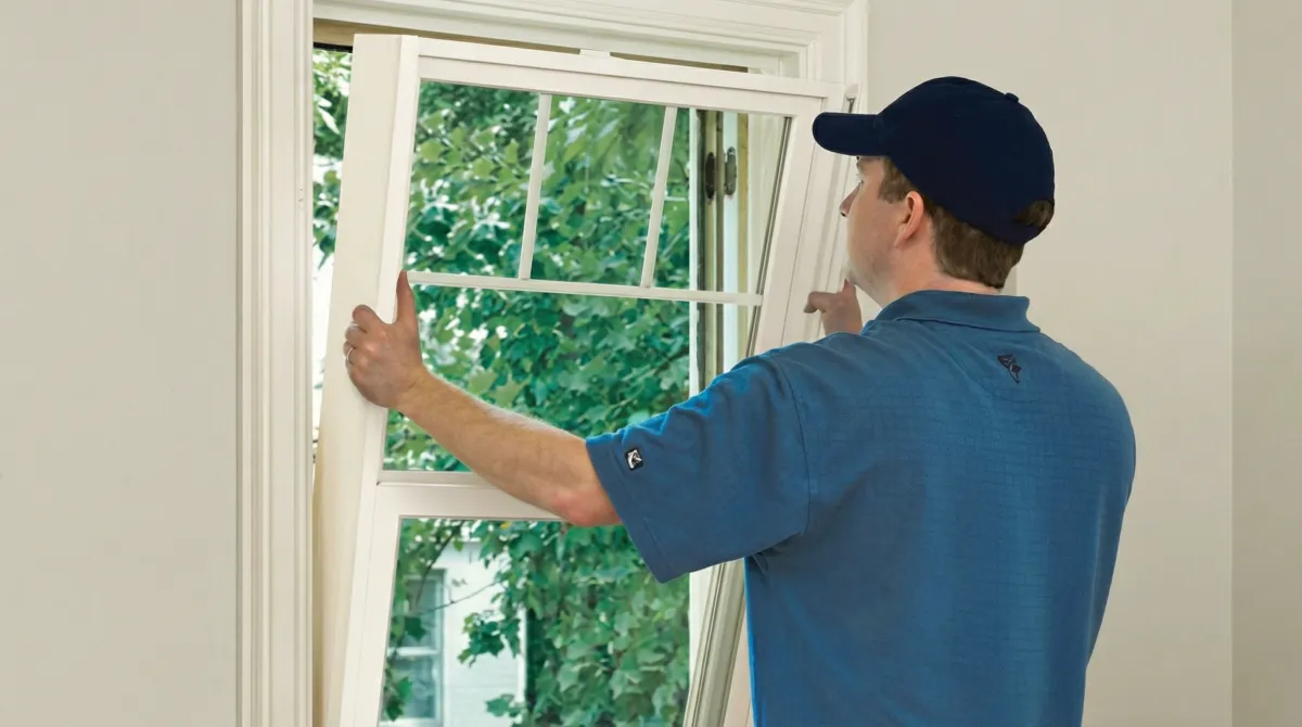 Professional contractors performing a residential window insulation and replacement service in Houston, TX